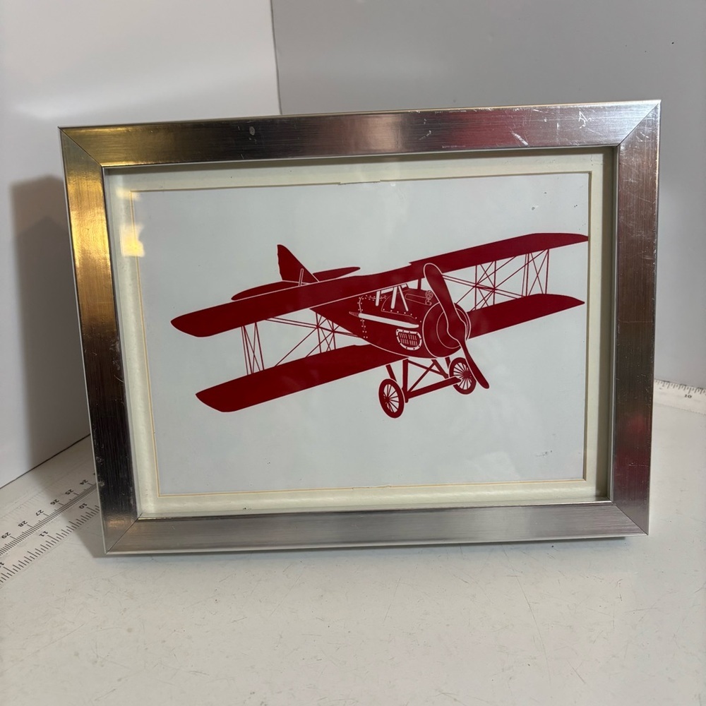 🛍️3/$30 Silver photo frame with red biplane on a white matte background